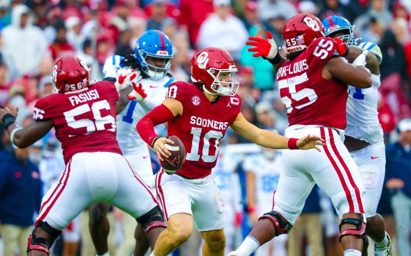 AI-assisted summary
No. 8 Mississippi’s win over No. 11 Oklahoma has essentially secured the Rebels a spot in the College Football Playoff.
Oklahoma’s playoff chances are slim after the loss, and the team faces a difficult schedule to close out the season.
Vanderbilt, Brigham Young, and Iowa were among the weekend’s biggest winners, with each team improving its postseason outlook.
No. 8 Mississippi’s 34-26 win against No. 11 Oklahoma is essentially a College Football Playoff clincher for the Rebels, who avoided a second loss in as many weeks and close with South Carolina, The Citadel, Florida and Mississippi State.
While they’ll be expected to run the table in November, the Rebels could likely survive a second loss and earn an at-large berth. Not so for Oklahoma, which may needs to win out against a brutal four-game run to cap the regular season.
No team in the Bowl Subdivision will have it tougher down the stretch. The Sooners will play No. 17 Tennessee and No. 4 Alabama on the road and then face No. 14 Missouri and No. 19 LSU at home.
The odds of a playoff berth are growing increasingly slim. A more pertinent question with a crucial run ahead: Can the Sooners and Brent Venables salvage some lost momentum with a strong November and at a minimum avoid a highly scrutinized offseason?
Doing so would require some major growth from an offense that has cratered after a strong start, in no small part because of an injury to quarterback John Mateer. While he missed only the Kent State win, the Washington State transfer has two touchdowns against three interceptions and just 36 rushing yards in his past three games.
And while the defense has helped carry the load, the Rebels gained 431 yards and ran 87 plays, eventually wearing down the Sooners’ defense and owning the fourth quarter.
There needs to be a recalibration of expectations. This isn’t an elite team, the earlier win against No. 24 Michigan notwithstanding; the Wolverines would probably be favored if the two teams met next Saturday. Oklahoma is a pretty good team in a brutal conference that chews up and spits out good teams.
At this point, the Sooners have to win at least one and likely two games in November to develop some momentum heading into what should be a make-or-break 2026 season for Venables.
Oklahoma and Vanderbilt lead Saturday’s biggest winners and losers:
Winners
Vanderbilt
This is the world we live in: No. 2 Indiana is an absolute behemoth and No. 10 Vanderbilt is pretty damn good, too. The Commodores scored one of the biggest regular-season wins in program history by beating Missouri 17-10, securing the victory with a late defensive stand after taking the lead on a Diego Pavia touchdown run with under two minutes to play. Now 7-1 and with beleaguered Texas up next, Vanderbilt is inching closer to an unexpected playoff berth that would speak to the wildly increased level of parity in the Power Four. Pavia had 149 yards of offense and that one score while Missouri lost starting quarterback Beau Pribula to an injury early in the second half.
Texas A&M
No. 3 A&M actually trailed LSU 18-14 at halftime, which makes it even more ridiculous to see the Aggies lead 35-18 with four minutes left in the third quarter. This 49-25 win was a story of two programs heading into opposite directions: LSU is down, down, down under Brian Kelly while the Aggies are flourishing in a major way under second-year coach Mike Elko. The highly impressive third quarter showed that A&M is not just capable of winning the SEC but the whole thing, too, especially with the way the offense, defense and special teams worked in concert to bulldoze hapless LSU. At this point, the Aggies are everything the Tigers are not.
Brigham Young
Unbeaten but still not taken too seriously as a legitimate contender, No. 10 Brigham Young climbed out of a pair of double-digit holes in the first half and scored a 41-27 win at Iowa State behind an eye-opening game from freshman Bear Bachmeier. While the Cyclones turned the ball over four times, including three interceptions from Rocco Becht, Bachmeier threw for 307 yards, ran for a team-high 49 yards and had three combined touchdowns with no giveaways. Being plus-four in turnovers meant the difference for the Cougars, who were outgained overall and gave up 184 yards on the ground. Now 8-0, BYU has turned a corner as a program the past two seasons.
Iowa
While a shot the Big Ten crown is unlikely given an earlier loss to No. 2 Indiana, the recipe is coming together for Iowa just in time to make a serious run at an at-large playoff bid. The Hawkeyes combined an elite defense, a largely error-free performance on offense and opportunistic special teams to swamp Minnesota 41-3, continuing an outright ownership of this rivalry. (Some Big Ten math: Iowa is to Minnesota what Minnesota is to Nebraska, but Iowa is also to Nebraska what Minnesota is to Nebraska, if that makes sense.) Iowa got started with a 75-yard touchdown drive on the game’s opening possession and then scored on a pick-six and a punt return to lead 31-0 at halftime.
Houston
The Cougars are for real in coach Willie Fritz’s second season. (He’s won everywhere else he’s been, so we’re not surprised.) While No. 25 Arizona State made things tight by scoring 16 points in the fourth quarter, beating the Sun Devils 24-16 in Tempe might be the program’s best wins in years given how firmly Houston is now set as one of the top contenders in the Big 12 heading into November.
Losers
UCLA
Nico Iamaleava was sacked on the first play of scrimmage, tossed a pick-six a play later and things didn’t get much better for UCLA, which completely outclassed in a 56-6 loss to Indiana that snapped a three-game winning streak in Big Ten play. Iamaleava completed 13 of 27 throws for 113 yards and had two interceptions as the Hoosiers held UCLA to just 201 yards on 3.8 yards per play. While not unexpected, the loss does reveal the Bruins’ inherent flaws heading into games against Nebraska, No. 1 Ohio State, Washington and Southern California to end the regular season.
Brian Kelly
Red-faced and furious Brian Kelly we know. But we’re becoming more familiar with where-am-I-and-what’s-happening Brian Kelly, who had blank stares and few words as A&M was driving his team into the ground in the second half. That he’s running out of answers means LSU is running out of time and patience with a coach who is destined to become the first since Gerry DiNardo to not win a national championship with the Tigers.
Bill Belichick
Moral victories aren’t why UNC is paying a six-time Super Bowl champion $10 million per season. But that’s where we are with the Tar Heels, who fought and clawed to hang with No. 16 Virginia – just like California the week before – but lost 17-16 in overtime to fall to 2-5 overall and 0-3 in the ACC. The defense has made some nice gains since the opener against TCU, but the UNC offense is a punchless and inept group that will clearly need to be redone this offseason. The big question: Will Belichick be around for the overhaul?
SMU
Wake Forest drilled a 50-yard field goal with no time left and topped SMU 13-12 to snap the Mustangs’ 20-game winning streak in regular-season conference games, the longest streak in the FBS. Now with a loss in conference and three overall, SMU can only make a return trip to the playoff by winning out – and getting a little bit of help along the way – to reach the ACC championship game. That’s good news for Arkansas, which has zeroed in on SMU coach Rhett Lashlee to replace Sam Pittman and could make that hire official in early December instead of waiting until later in the month.
South Florida
The No. 20 Bulls led Memphis 21-7 in the second quarter, 24-14 at halftime and 31-17 heading into the fourth quarter but lost 34-31 after missing a 52-yard field goal as time expired. This is an awful loss for a team that went into the weekend atop the American and in the driver’s seat for the Group of Five’s guaranteed playoff bid. It’s also hard to see how this happened: USF racked up 564 yards overall, ran for 295 yards on 7.8 yards per carry, held Memphis just 3.8 yards per carry and converted 12 of 18 third-down attempts. The loss drops the Bulls a game behind Navy in the conference standings.
This post appeared first on USA TODAY