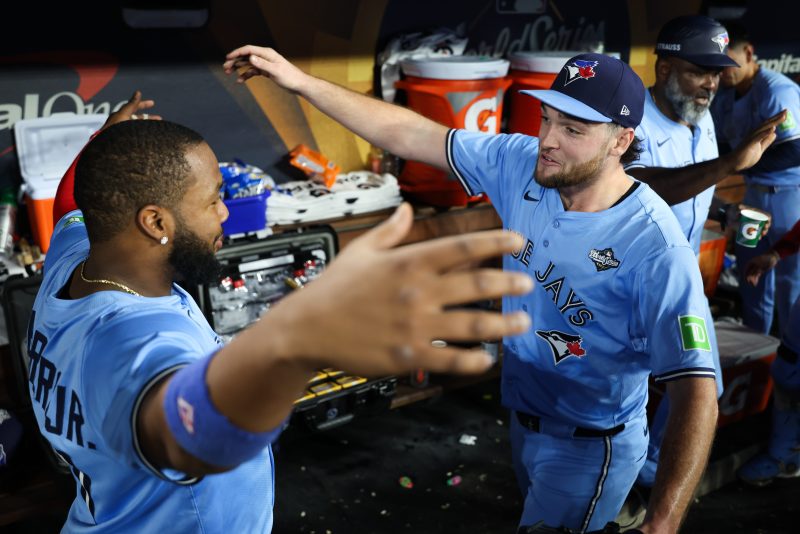 LOS ANGELES — Trey Yesavage has provided a wonderful little reminder to the global baseball community: It’s possible that something special, so historic, so dominant, can remain a secret.
Make no mistake: Word is out now.
Tens of millions of fans from Canada to Tokyo to Sunset Boulevard now know plenty about Yesavage, about the 22-year-old’s crazy arm angle and audacious splitter, his preternatural calm and this historic postseason run that has put the Toronto Blue Jays on the verge of a World Series championship.
A few million more found out Oct. 29, when Yesavage walked into Dodger Stadium and in Game 5 of the World Series brought a lineup filled with Hall of Famers, a roster of defending World Series champions and more than 52,000 fans to their knees with a suffocating performance.
Across seven innings, he struck out a dozen batters, held the great Shohei Ohtani, Mookie Betts and Freddie Freeman hitless in 11 at-bats, and pitched the Toronto Blue Jays within one win of their first World Series title since 1993 with a 6-1 victory over the Dodgers.
The Blue Jays can win it all with a victory in either Game 6 or Game 7 this weekend in Canada.
And stunningly enough, arguably the most important figure in their playoff run not named Vladimir Guerrero Jr. was just a rumor to his veteran teammates a few months ago.
That’s what happens when you don’t get invited to big league camp. When your platform season in college gets disrupted by a partially collapsed lung. And when your first professional pitch, even as an advanced college draftee, is thrown in low Class A Dunedin, where the Blue Jays’ Florida training facility commences the organizational process of separating the no-ways from the maybes.
Yet there’s one guy who saw this coming.
Perhaps not that Yesavage would climb four rungs of the organizational ladder and reach the big leagues in September. Nor that he’d be their stealth No. 2 playoff starter and smash the postseason record for strikeouts by a rookie, with 39 in 26 often electric innings.
But when center fielder Daulton Varsho commenced a rehab assignment at Dunedin to begin his own climb back from rotator cuff surgery, he saw it.
No, it was not like Game 5 of the World Series. The opponent way back on April 19 was the Lakeland Flying Tigers, not the Los Angeles Dodgers, and the top of the lineup was comprised of Hadeen, Montilla and Fana, not Ohtani, Betts and Freeman.
But stuff is stuff. And dudes are dudes. And Yesavage was definitely both for both.
“It was right away. I knew he was just different,” says Varsho, who had a great view of Yesavage’s Game 5 dominance from his center field perch. “Just by the way he carried himself. His mentality. Just one of those kids you don’t really run into very often.
“And you can tell he’s just different from the get-go.”
Still, despite omnipresent prospect rankings and live streaming and advanced pitch data, to most of the Blue Jays, Yesavage’s exploits were snippets of information crackling across ham radio.  
Max Scherzer, the Blue Jays’ 41-year-old starter, knew the name. Heard right around midseason that he was “striking out everyone in the minors.” Thought Yesavage might be trade deadline fodder, as veterans greedy for late-season reinforcements often believe.
Chris Bassitt, Scherzer’s buddy in Toronto’s rotation, knew the club had drafted Yesavage 20th overall out of East Carolina a year ago. Didn’t see him in spring training – the kid hadn’t yet been invited to varsity camp. And like most 36-year-old veterans, defaulted to skepticism.
“You’re in the minor leagues until you’re not,” says Bassitt. “And then it’s like, how do big league hitters approach you?”
And that’s where the puzzle started to come together: Because big league hitters looked downright stupid against him.
Uptown funk
Yesavage debuted Sept. 15 against the Tampa Bay Rays, made three regular season starts, and eyebrows started to arch.
The stuff was legit. And with Scherzer and Bassitt both on the rebound from injuries, the Blue Jays thought the kid could hold down the fort at least partially due to opponent unfamiliarity.
And then came Oct. 5, AL Division Series Game 2, and perhaps the moment that forever changed Toronto’s franchise.
“When you see MVPs and top players in the league take some of the swings they take at his stuff, that’s a really positive sign,” says closer Jeff Hoffman, who finished Game 5 with a scoreless ninth inning.
“You don’t get these guys to look like that, if your stuff’s not real. He got to see, the stuff is real. You’re playing against the Yankees. And they’re still taking those bad swings.”
And when Yesavage struck out seven of the first 10 Yankees, Rogers Centre roared. This thing was real.
Yet in the Blue Jays dugout, Shane Bieber needed to see one more trip around the lineup to make sure he could believe what he was seeing. Bieber, the former Cy Young Award winner who saved the Blue Jays by winning World Series Game 4, knew the Aaron Judges and Cody Bellingers of the world could be made to look silly. Maybe once.
“He’s got some funk to him,” says Bieber. “A different arm angle and pitch repertoire, but seeing how experienced big league hitters will adapt from at-bat to at-bat is a pretty good indicator how your stuff’s playing, from any given situation day to day.
“Second time through the order against a team, a lineup like that Yankees, the swings he was inducing, definitely inspired some confidence in our club.”
And so Yesavage went out for the fourth inning that day, and struck out Aaron Judge, Cody Bellinger and Ben Rice swinging. The Blue Jays had their ace.
Fast forward 24 days, and here was another perennial MVP, Ohtani, swinging so foolishly at a Yesavage splitter in the third inning, his helmet flew off.
And Max Muncy, gifted with one of the greatest batting eyes and plate discipline skills of his era, taking three steps toward first before he was told, come back, catcher Alejandro Kirk held that full-count slider just inside the bottom of the strike zone.
He punched out both Hernandezes, Teoscar and Kiké. Got spot starter Alex Call to offer just enough at a slider in the dirt that the first base umpire punched him out.
He got ‘em all: Twelve strikeouts in all, just the 11th in history to do so and the first since Orlando “El Duque” Hernandez punched out a dozen New York Mets in 2000.
“I think he was extremely convicted tonight,” says Bieber. “Has been through most of his starts. Credit where credit’s due: Kirky called an incredible game tonight, caught the ball extremely well. Got those low pitches, those high pitches for Trey.
“With a guy coming from that arm angle, it’s paramount to get those borderline pitches.”
‘He gets it’
Now, Yesavage has probably thrown his last pitch of 2025. Sure, the Dodgers could win Game 6, and Game 7 could go sideways, and maybe manager John Schneider might call on the kid for an out or two.
But it’s likelier that postseason line will be locked in: 39 strikeouts in 26 innings, a 1.04 WHIP, a .187 batting average.
And, absurdly, five playoff games under his belt, two more than he’s pitched so far in the regular season.
It’s been something of a running joke that Yesavage, in a clubhouse full of well-minted superstars, has hardly received any big league scratch. Just the pro-rated minimum for the two weeks he was up.
Yet the Blue Jays will see to it his playoff share is fair.
“I mean, this playoff paycheck is going to be nice whenever it hits,” says Yesavage.
All kidding aside, the symbiotic relationship between the Blue Jays’ veteran (and oft salty) pitching staff and the newbie who will still be a rookie throughout 2026 can’t be underestimated.
The vets laugh off his occasional rookie obliviousness. The kid appreciates it, and rewards them with ice cold performances on the mound.
 “They have treated me the best I could have ever asked for,” says Yesavage. “So going forward with other rookies that come up, I’m going to remember how I was treated when I got here.
“The poise part, I don’t know, you got to thank my parents.”
Perhaps it’s the water in Boyertown, Pa. Nature, nurture or otherwise, the Blue Jays don’t hesitate to trot out the “built different” trope around Yesavage.
Bassitt has seen plenty in his 11-year career. He recognizes that Dodger Stadium is not the typical environment. The sound system thunders, there’s an MVP in every crevice of the lineup, and a Magic Johnson or a Jason Bateman or a Sandy Koufax might catch the corner of your eye if you look around enough.
And yet Yesavage stood up to it all.
“He’s just completely composed. Which is crazy for how young he is,” says Bassitt. “Hats off to those who coached him, who raised him. Because he’s very, very calm under pressure.”
And Bassitt rejects any notion that Yesavage simply is too young, too inexperienced to realize what he’s doing.
“He’s pretty smart. He gets it,” he says “Some guys are just built different. Mentally built different.
“The fact he has the utmost confidence walking into this place? You come into this place and all of a sudden it’s like, damn, wow.”
In an era when World Series starters are lionized for five-inning bursts, Yesavage did not give up the ball until he completed seven innings. The last time he did that was also his last college start, a 7 1/3-inning gut check against Wake Forest in an NCAA regional, Yesavage just sufficiently recovered from a collapsed lung to make his post.
Sure, that Demon Deacons lineup had three future first-round picks in it, including slam dunk AL Rookie of the Year Nick Kurtz. Barely more than a year later, he put another seven innings in the books, under far different circumstances.
It bears mentioning again: Ohtani, Betts, Freeman. The defending champions, gunning for their third title in six years, pushed to the brink by a 22-year-old.
“When it’s on,” says Scherzer, “he can make anybody in the game look stupid.
“He went out tonight and really showed it.”
And now, there’s no need for second-hand reports, for buzz about the kid punching out wannabes in Dunedin or New Hampshire or Buffalo.
This was the biggest stage. Yesavage owned it. And while he knows exactly what it is he’s done, he’s not yet ready to put it in proper context.
I’m waiting for life to slow down in this off-season,” he says, “and just be able to collect my thoughts and my feelings on this crazy year.
“It’s a crazy world. Crazy world. Hollywood couldn’t have made it this good.”
This post appeared first on USA TODAY